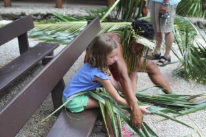 Chloe working like a true Samoan man to weave her basket.