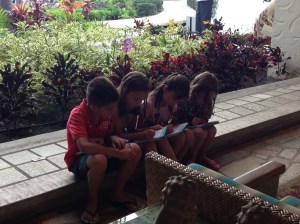 Working on their travel journals together.